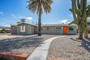 Front exterior with saguaro and gravel yard at Tucson Oasis, a Tucson, AZ vacation rental
