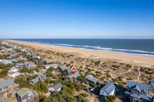 Aerial of the oceanfront cottage and beach at Hygge By The Sea, a Avon, NC vacation rental