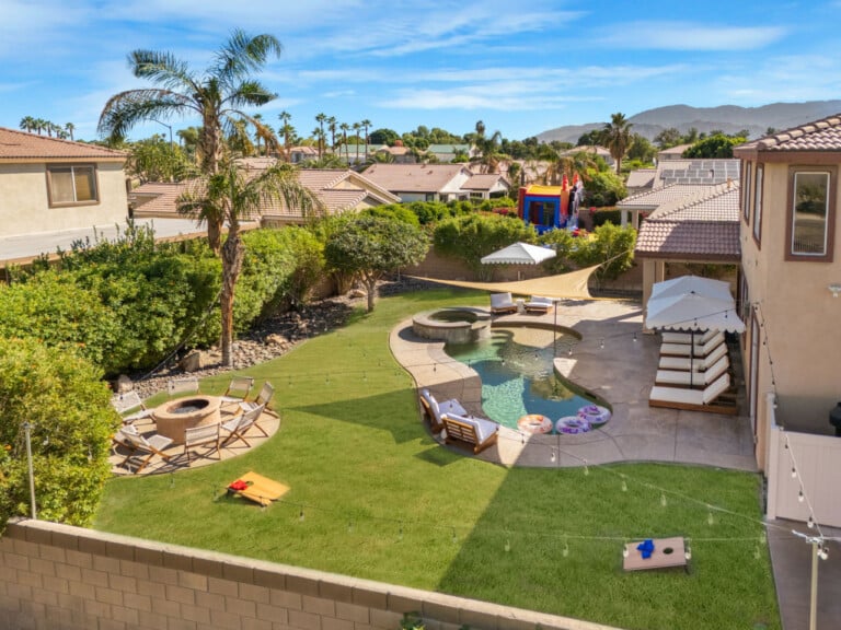 Aerial of the backyard with pool and fire pit at Coachella Sol Haus, a Indio, CA vacation rental