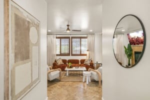 Living room seen through the round mirror at Coachella Sol Haus, a Indio, CA vacation rental