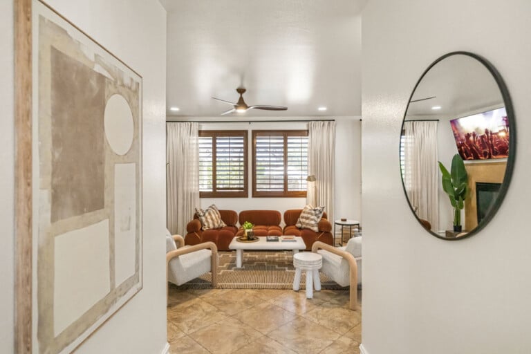 Living room seen through the round mirror at Coachella Sol Haus, a Indio, CA vacation rental