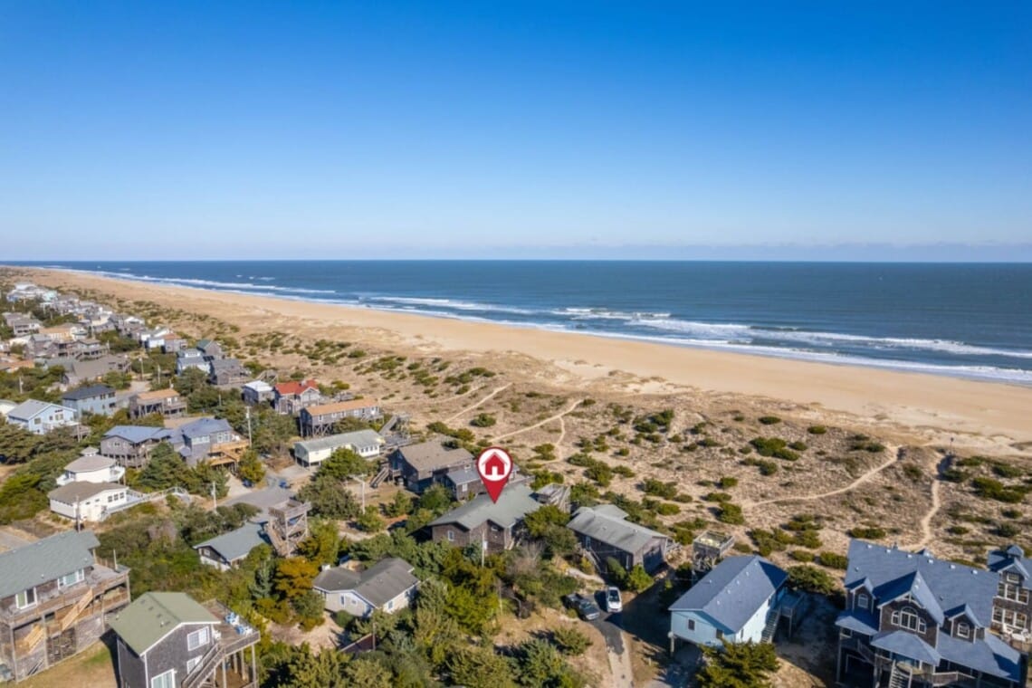 Aerial of the oceanfront neighborhood with marker at Hygge By The Sea, a Avon, NC vacation rental