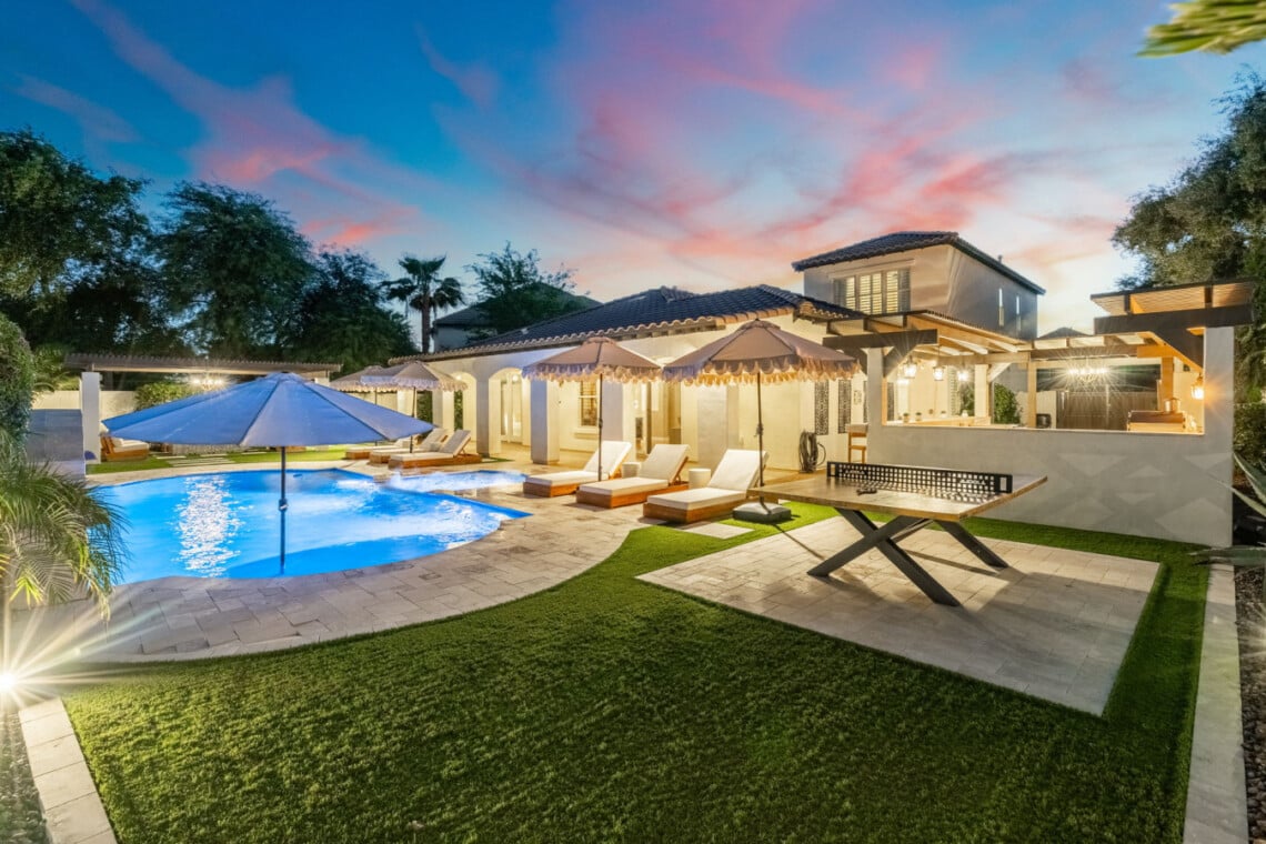Pool and covered patio at twilight at Sienna Sanctuary, a Chandler, AZ vacation rental