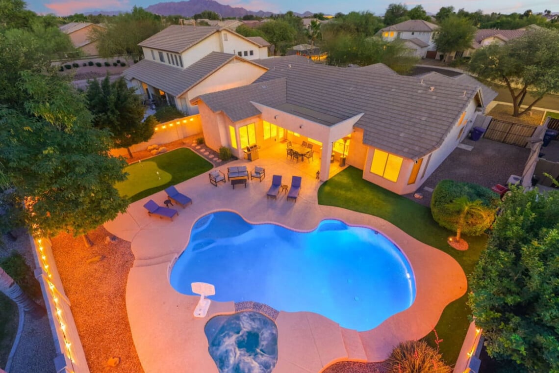 Aerial of the backyard pool at dusk at The Thirsty Cactus, a Chandler, AZ vacation rental